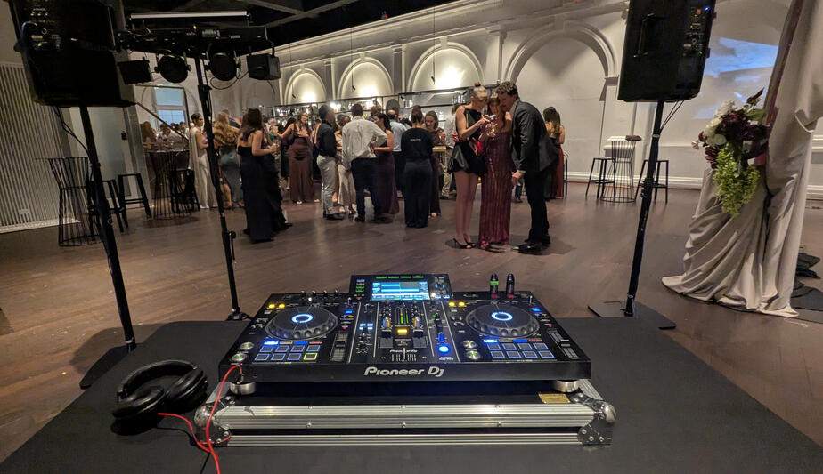 Moana Hall Wedding DJ Wedding DJ setup with Pioneer decks, JBL speakers.
