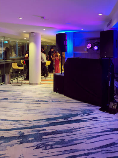 Wedding DJ setup with Pioneer decks, JBL speakers and lighting